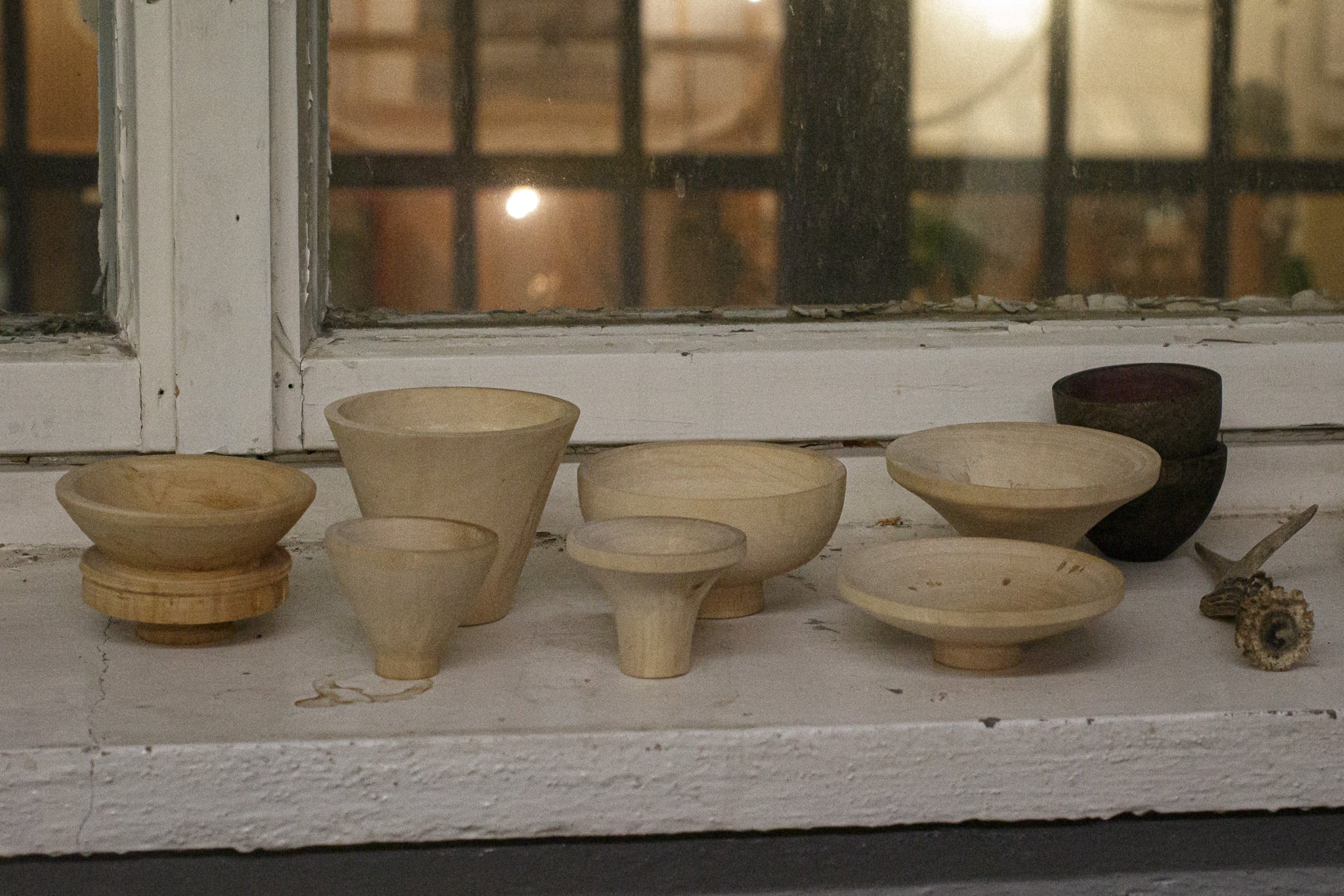 Hand-turned wooden cones that can be used as sound-shaping “ears” for the above-shown microphones.